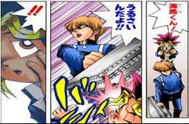 Kaiba hits Yugi with his briefcase.